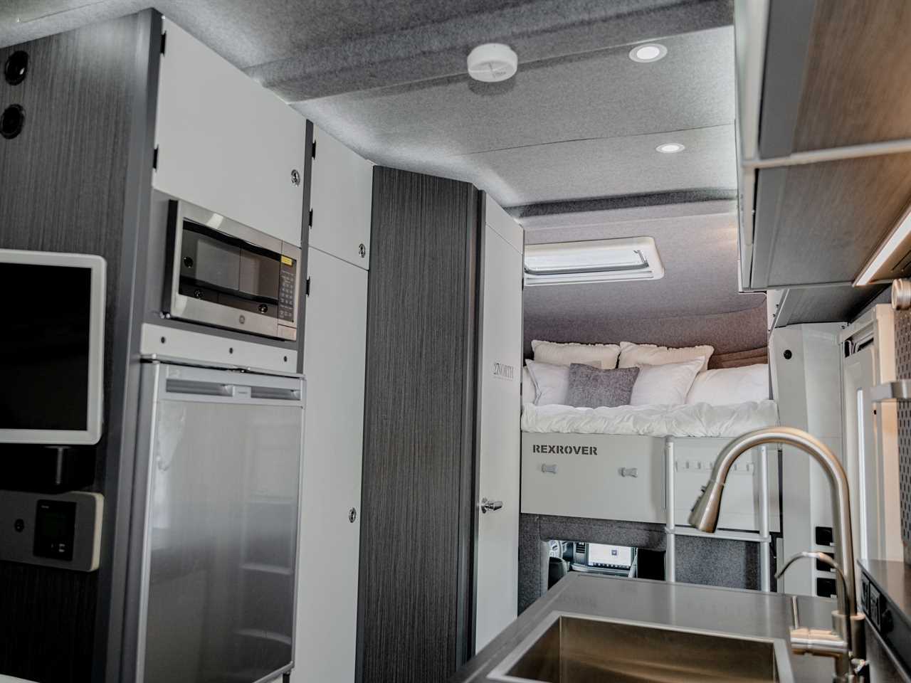 interior of the RexRover with a kitchen, bed