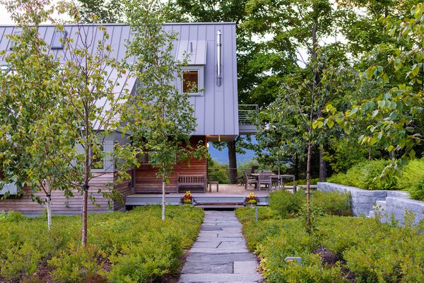 The design team used granite elements for landscaping and kept plantings simple and cohesive with the existing site. 