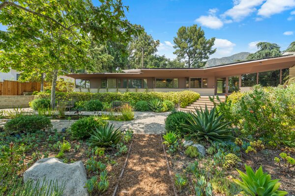 Surrounded by soaring trees and native vegetation, the Usonian-inspired home offers a tranquil city escape all while being just a 15-minute drive from Downtown Los Angeles.