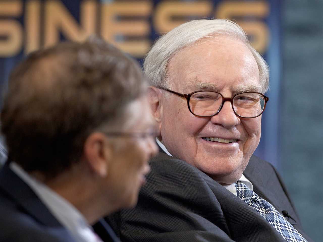 Warren Buffett, chairman and CEO of Berkshire Hathaway, right, listens to Microsoft founder and Berkshire board member Bill Gates during an interview with Liz Claman of the Fox Business Network in Omaha, Neb., Monday, May 7, 2012.