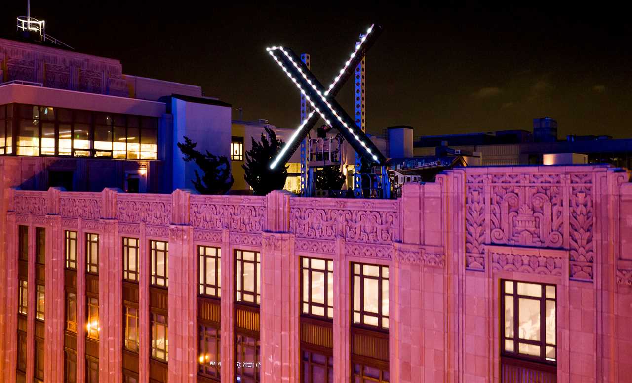 The X sign lit up at night on the company's San Francisco building