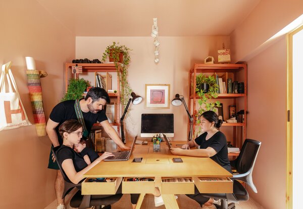 Instead of renting an office elsewhere, they took over their building’s front yard and expanded their ground-floor workspace into a nook they call El Retiro.At their plywood desk, the couple are sometimes joined by colleagues from JAG like Victoria Peralta or their daughter, Morena.