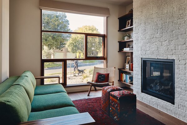 There are three living spaces in the home, and this one with the fireplace is deemed the most formal — for when grandparents are in town.