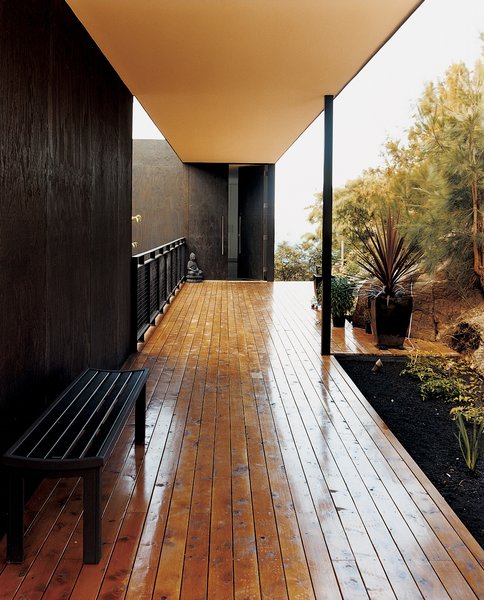 The outside deck, made of local celery-top pine, welcomes both humans and the natural landscape further into the house.