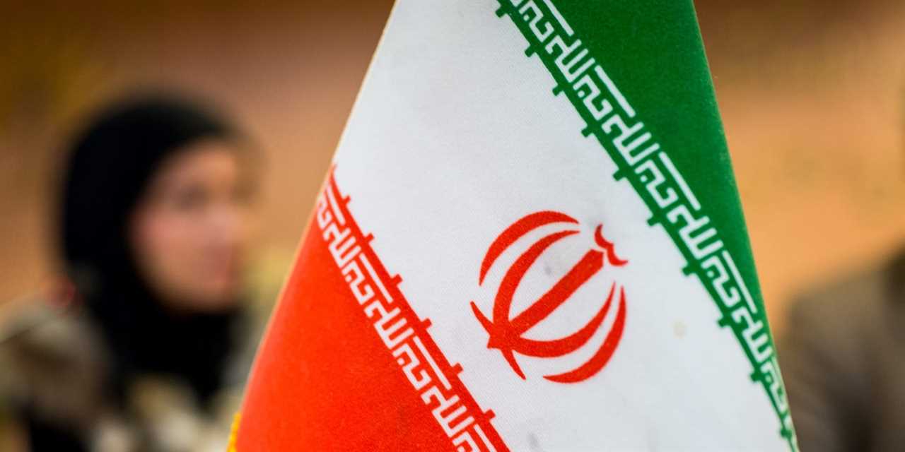 Iranian flag on conference table.