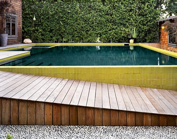 The final, layered look of the pool and its surroundings—which mitigates a 30-inch drop from house to guesthouse—was completed in 2008.