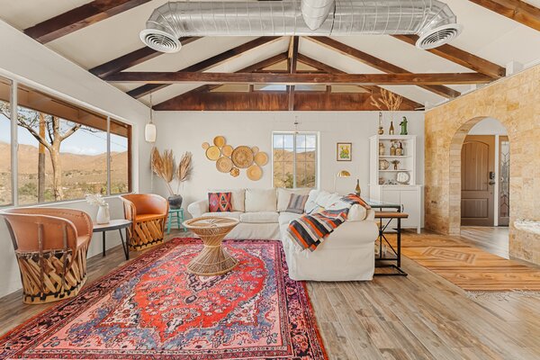 Vaulted ceilings and large windows enhance the sense of space in the main living areas.