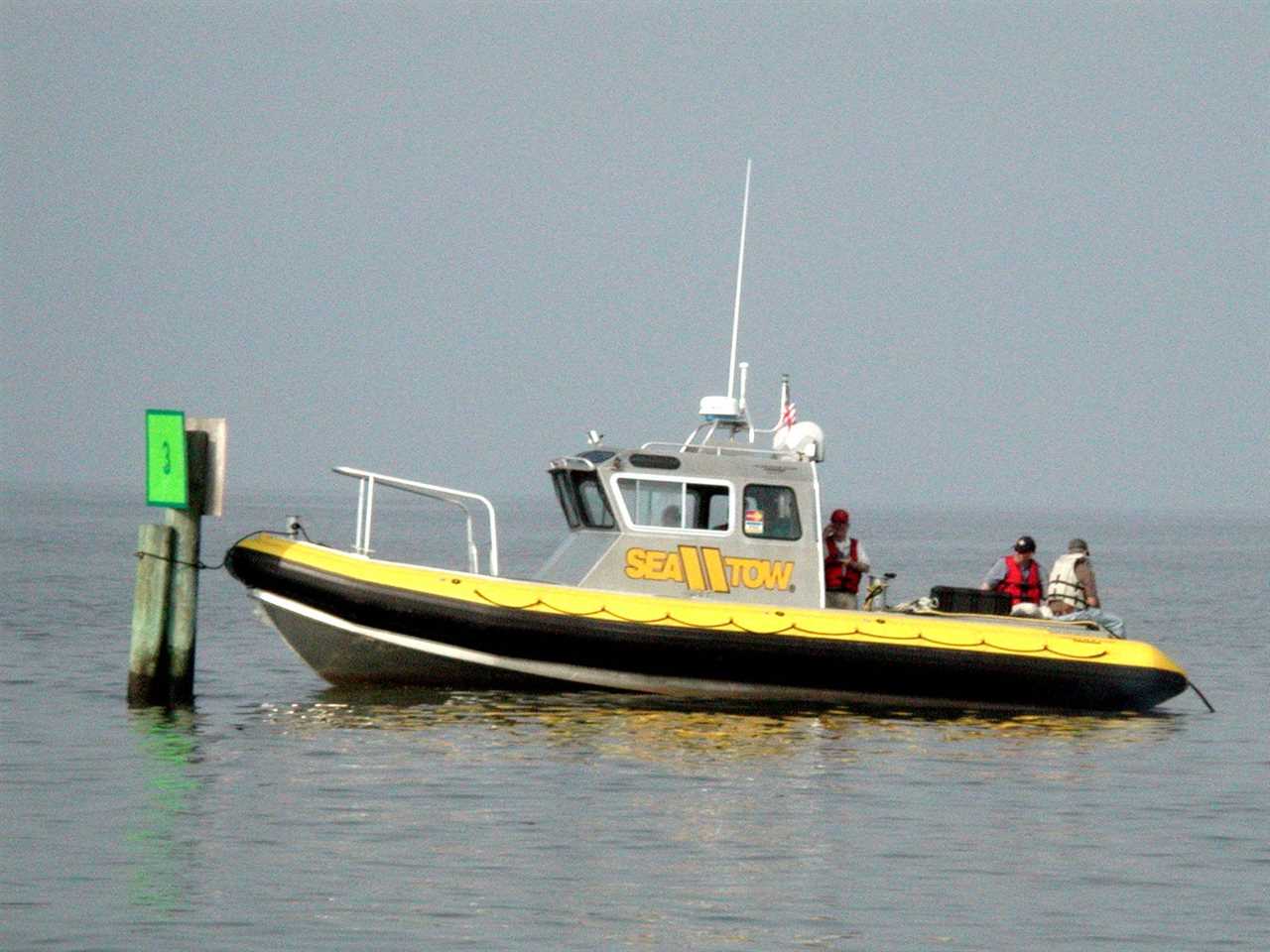 A yellow boat with several people aboard off the coast of Little Tybee, Georgia looking for a missing nuclear weapon