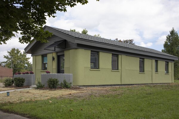 The 3D-print house was designed with neighborhood vernacular in mind—in the Detroit cottage style with a front porch with 3D-print planters.