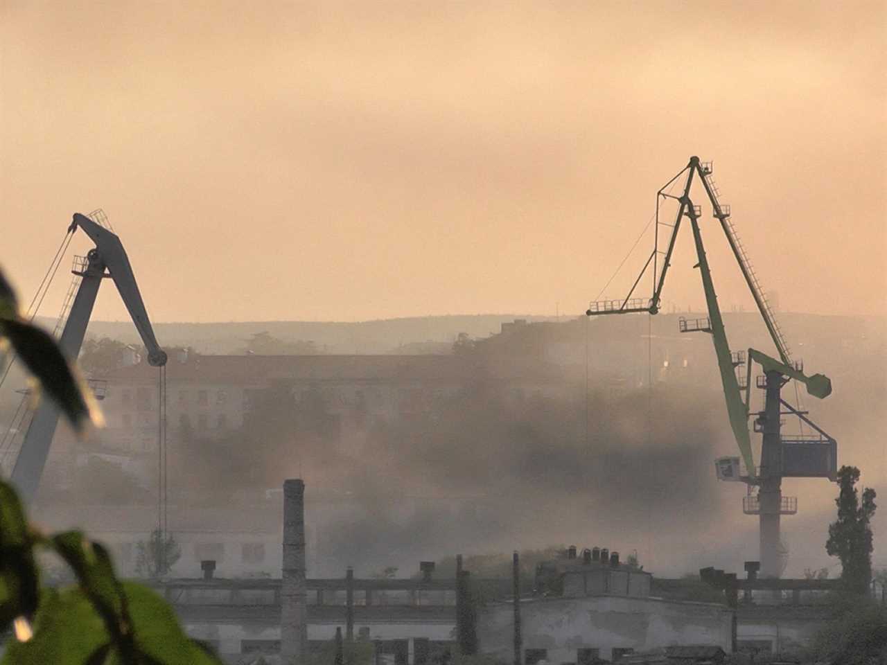 Smoke rises from the shipyard that was reportedly hit by Ukrainian missile attack in Sevastopol