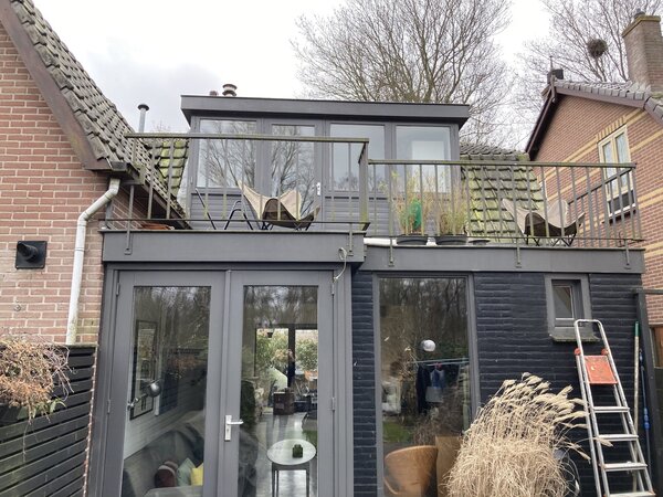 Before: The previous owners built an addition in 2008, which HOP architect Michael Cerrone  said had "no specific architectural style".  Here, it shares a wall with the more traditional brick addition on the duplex-neighbor's house.