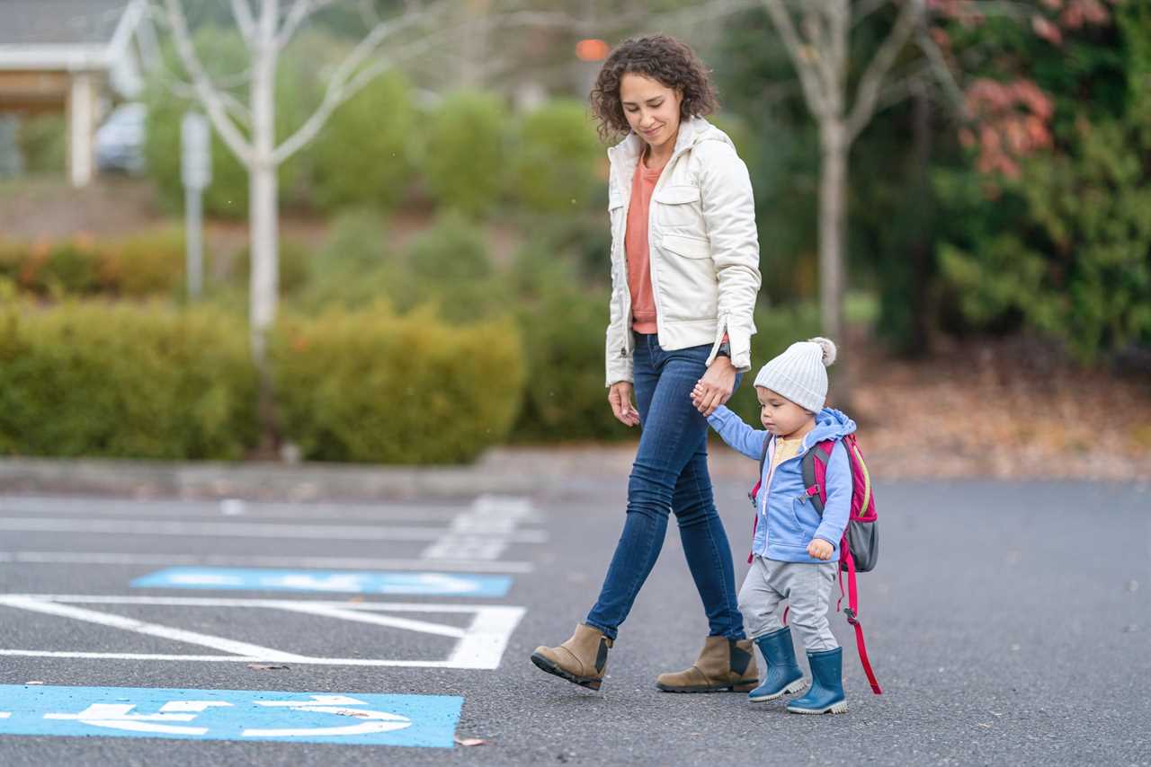 A woman drops a child off at preschool.