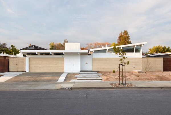 Blaine Architects capped the front addition to this Eichler home with a shed roof that mimics the slope of traditional Eichlers, but slants in the opposite direction to make it distinct. The wood screen is made from Accoya.