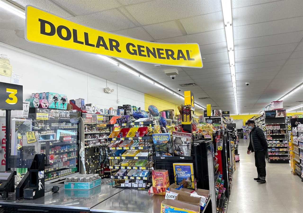 The inside of a Dollar General store in California, including a black and yellow "Dollar General" banner above the checkout area.