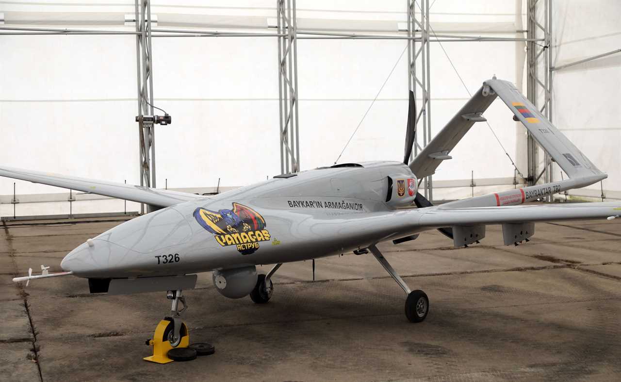 A Turkish Bayraktar TB2 combat drone is on view during a presentation at the Lithuanian Air Force Base in Siauliai, Lithuania, on July 6, 2022. - Lithuania on July 6, 2022 exhibited a crowdfunded Turkish-made military drone that it plans to send to Ukraine to help the war-torn country fight Russia's invasion