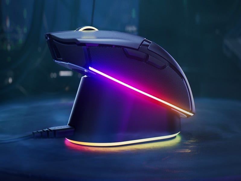 A Razer Cobra Pro mouse on a charing base.