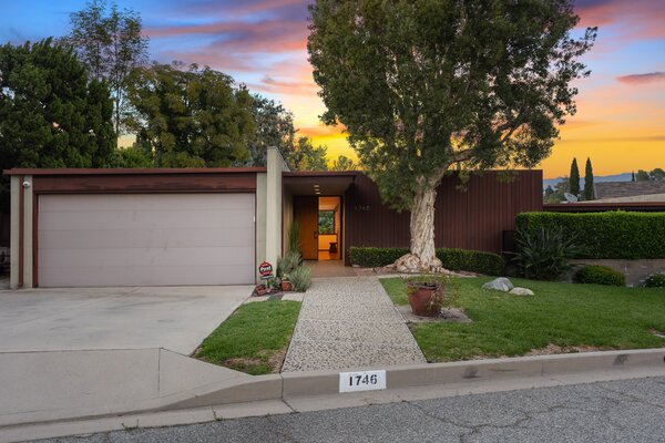 The home's expansiveness and perched positioning is cleverly hidden from street view.