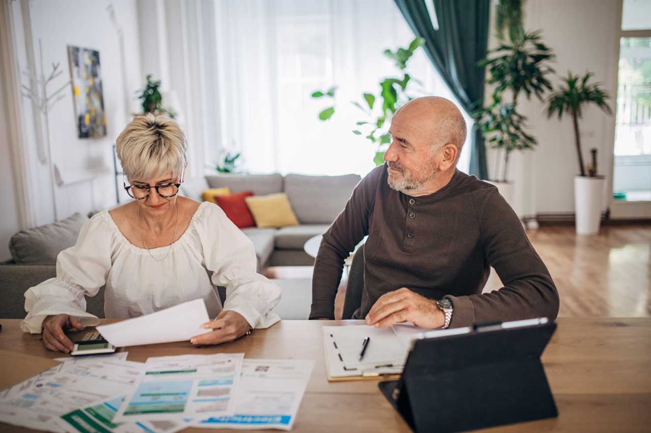 A couple calculating their retirement expenses.