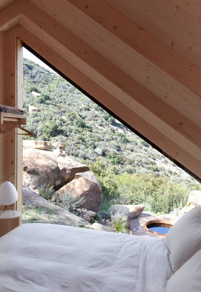 This cabin was just completed in the mountains of California, and it overlooks a plunge pool.