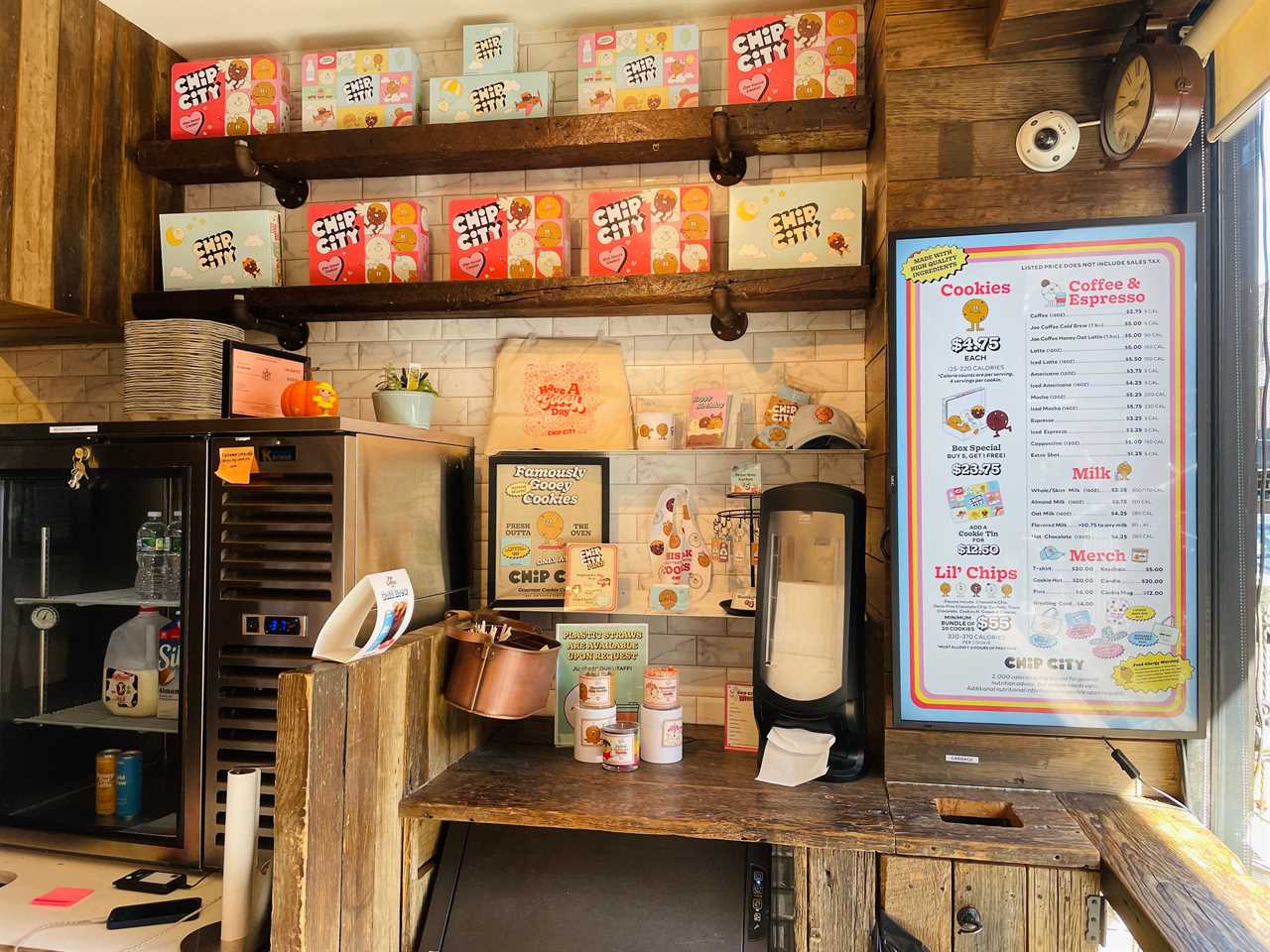 inside the Chip City Astoria store there is a menu and merchandise on display