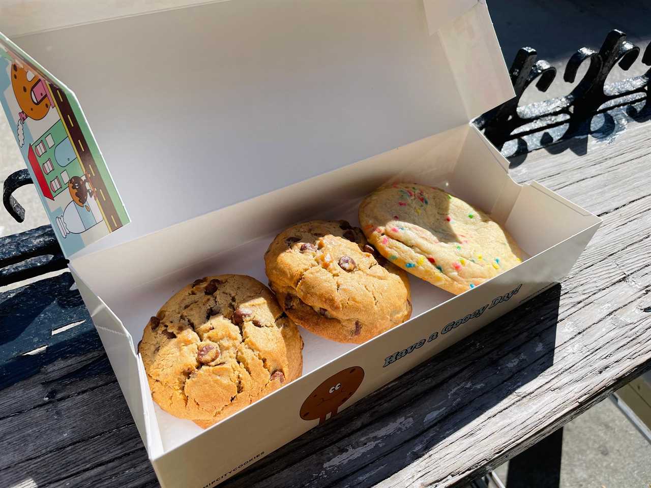 three cookies from Chip City sit in a branded box