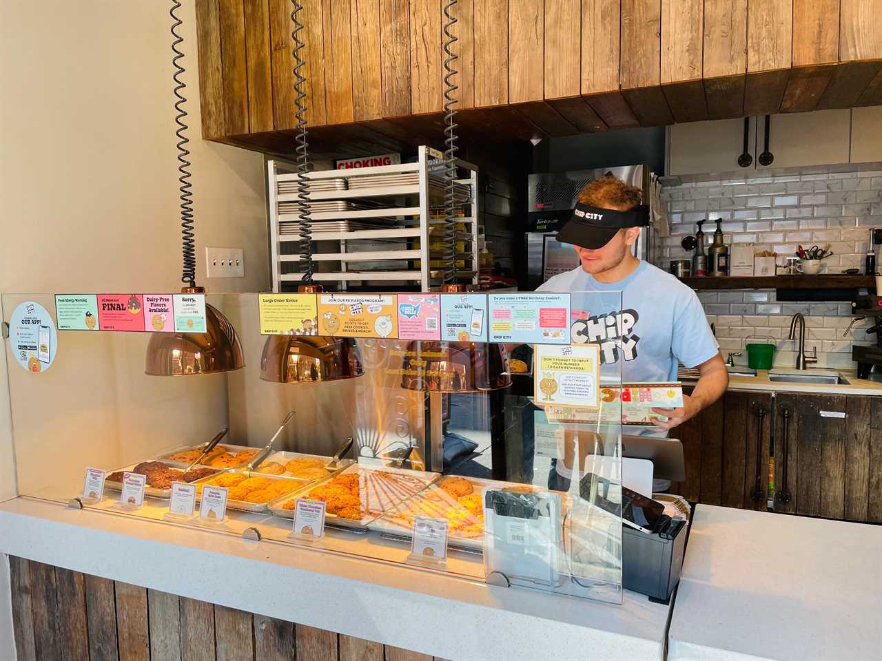 a chip city employee serves cookies