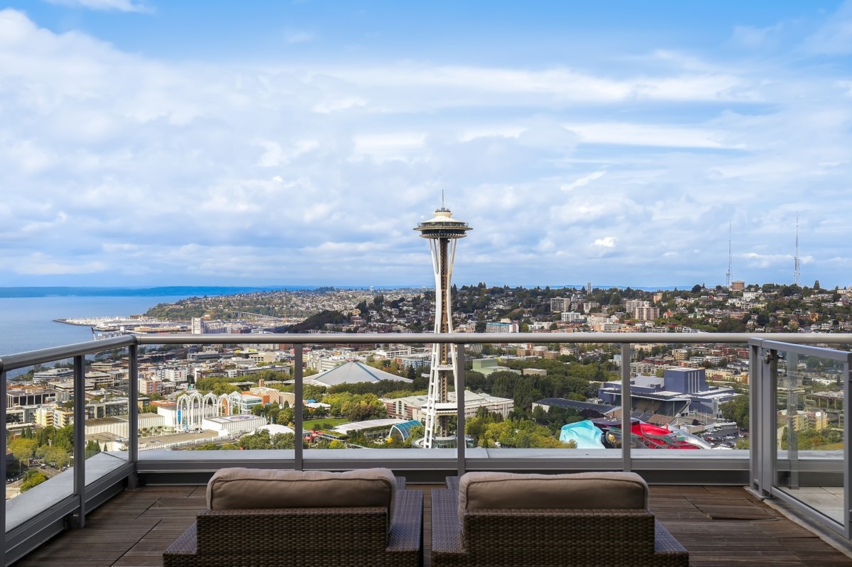 balcony view of the space needle in seattle on a cloudy day