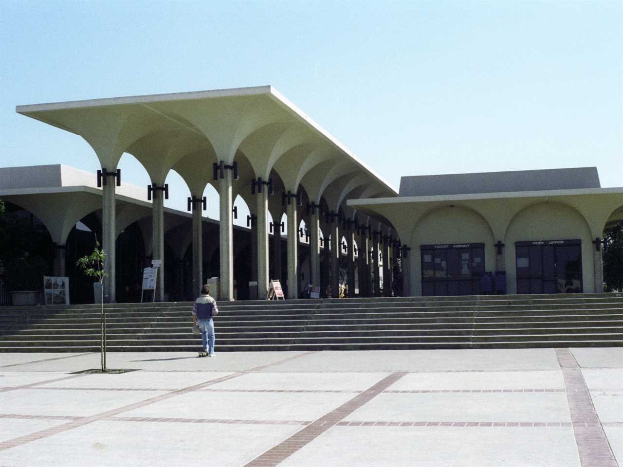 Student walks up steps to building at San Diego State University