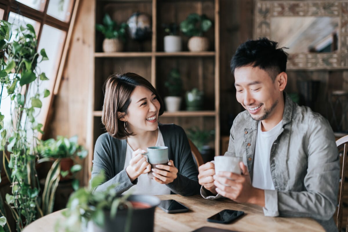 young man and woman enjoying a cup of coffee