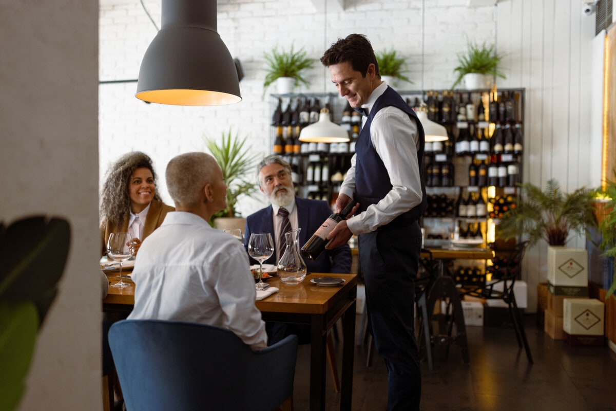 Business people having meeting at Luxury Business Dining restaurant. Vegan food served