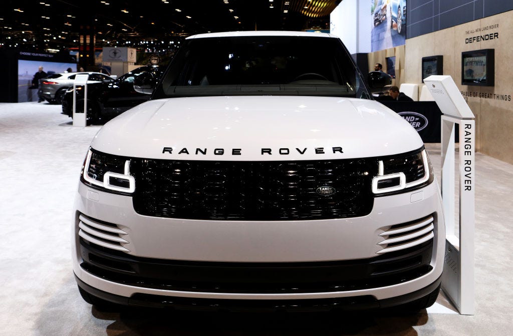 A Land Rover Range Rover on display at an auto show, seen from the front