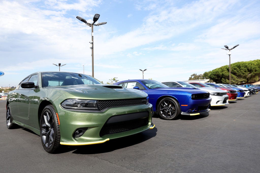 Dodge Charger cars are displayed on a sales lot