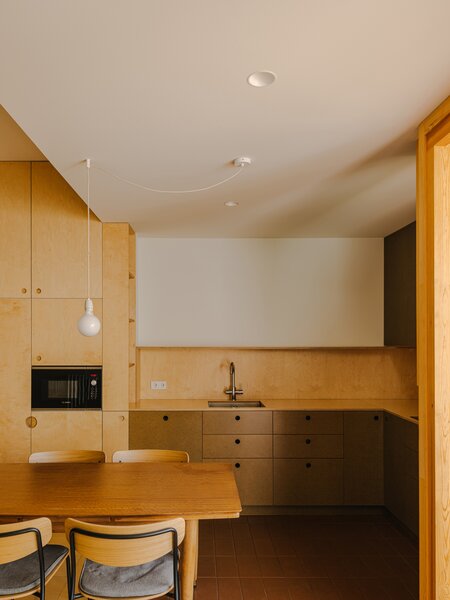 From Cabinets to Couches: Plywood Punches Up Nearly Every Corner of This Spanish Apartment