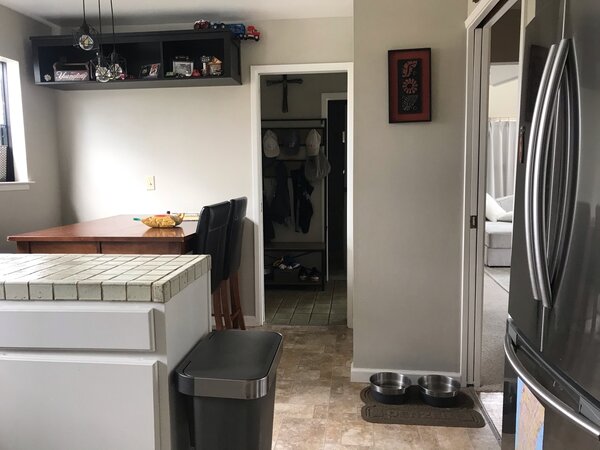 Before: The compact kitchen was closed off from the rest of the house and in an odd location just off the entryway.