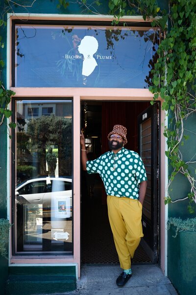 Maurice Harris stands in front of Bloom &amp; Plume, his floral design studio in Echo Park, Los Angeles.