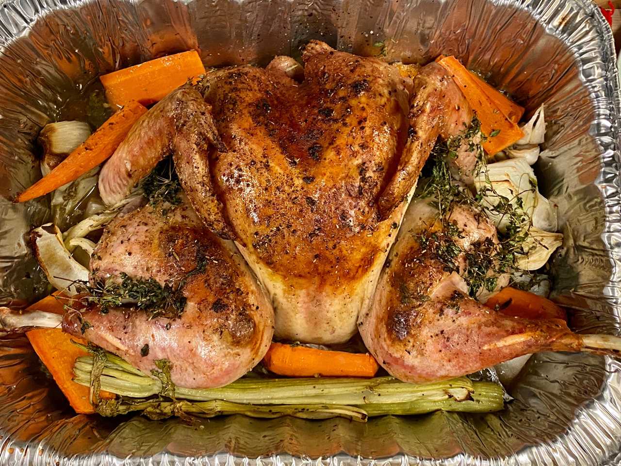 A roasted turkey with vegetables.