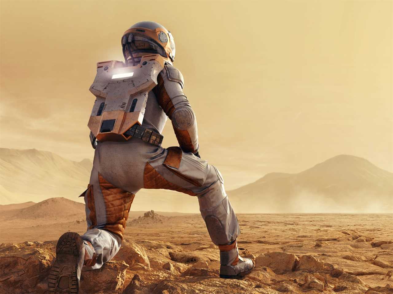 An artist's impression shows an astronaut kneeling down on Mars as a rocket is shown in the background. The landscape is barren and dusty.