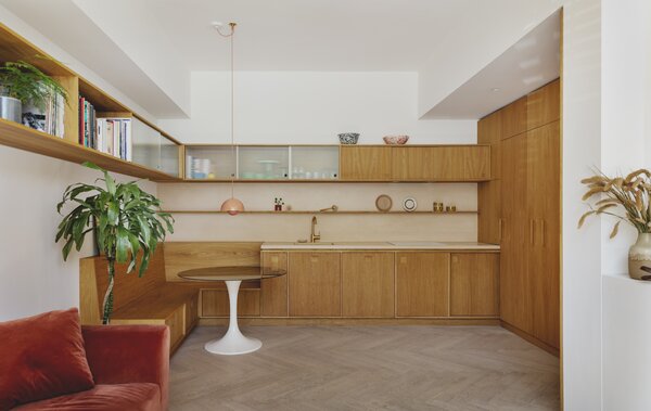 Oak Cabinets, Cupboards, and Banquet Seating Reset a Small East London Flat