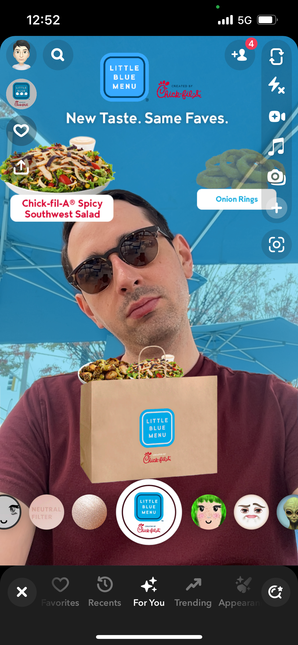 A Snapchat filter designed for Little Blue Menu features Insider reporter Alex Bitter selecting items from the restaurant's menu. The items are then placed into a bag that users can feature in a snap.