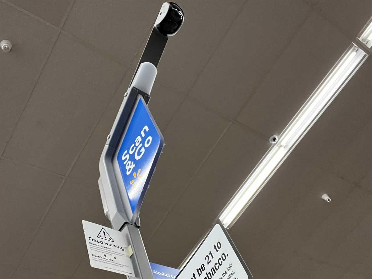 An overhead security camera at a Walmart self-checkout station.