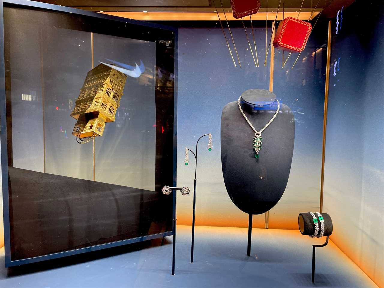 a holiday window display at Cartier showcases jewelry