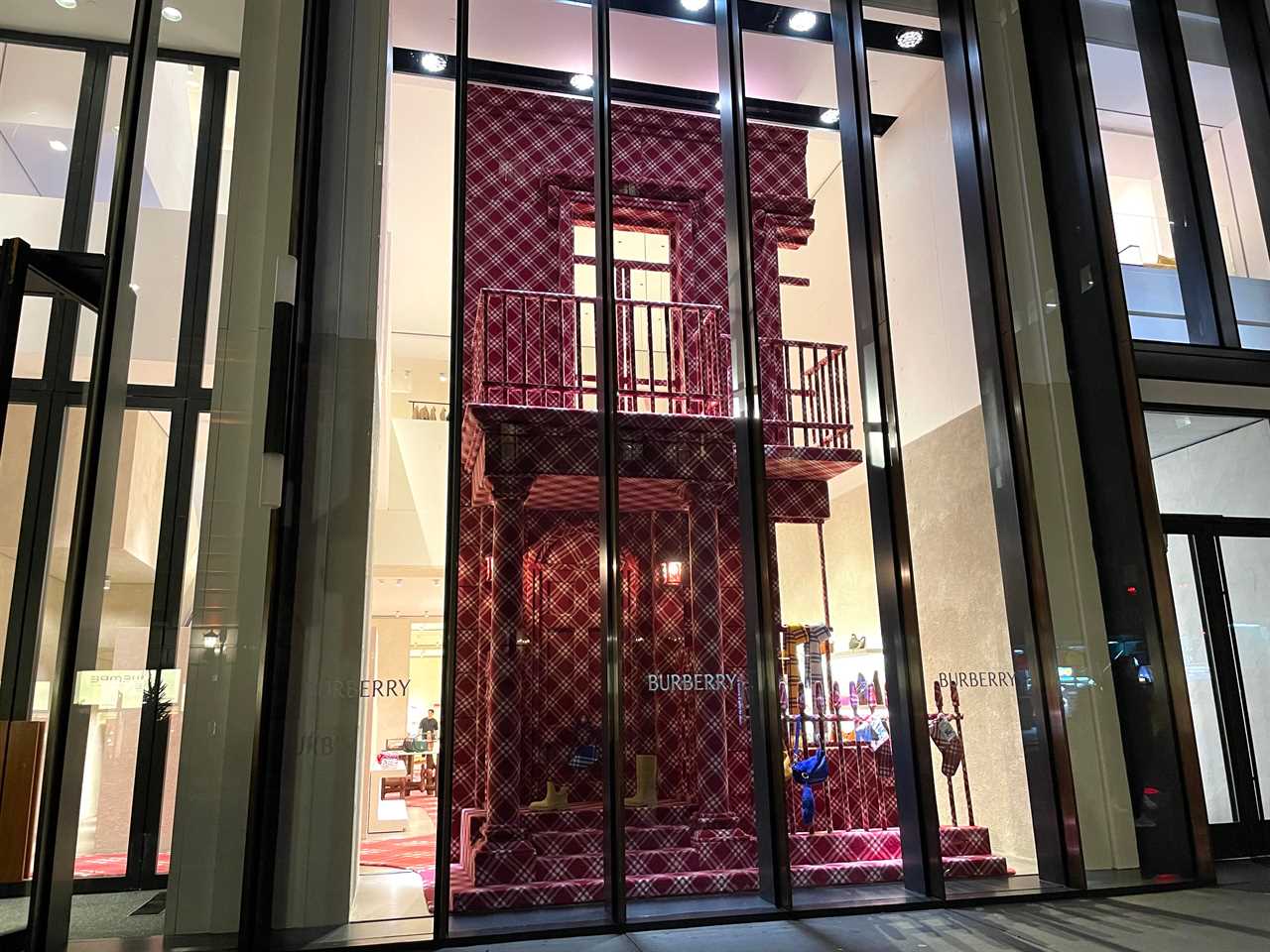 the holiday windows at Burberry show a building facade covered in plaid