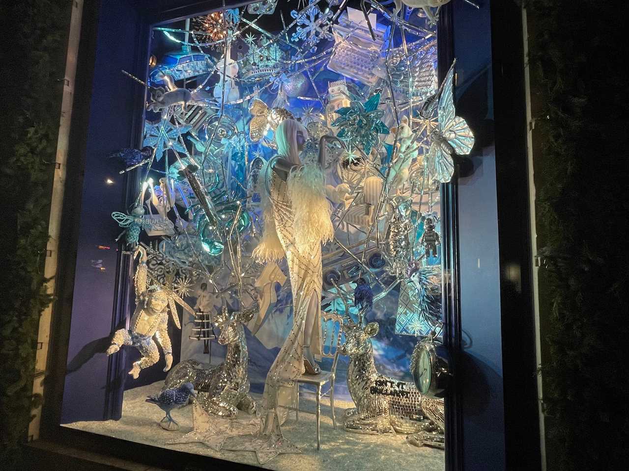 a holiday window at Bergdorf Goodman is a compilation of shiny objects