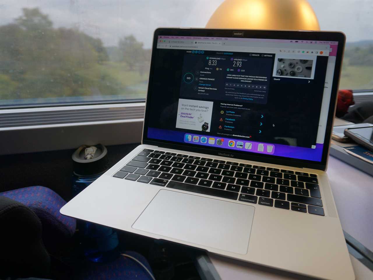 A laptop open on a train.