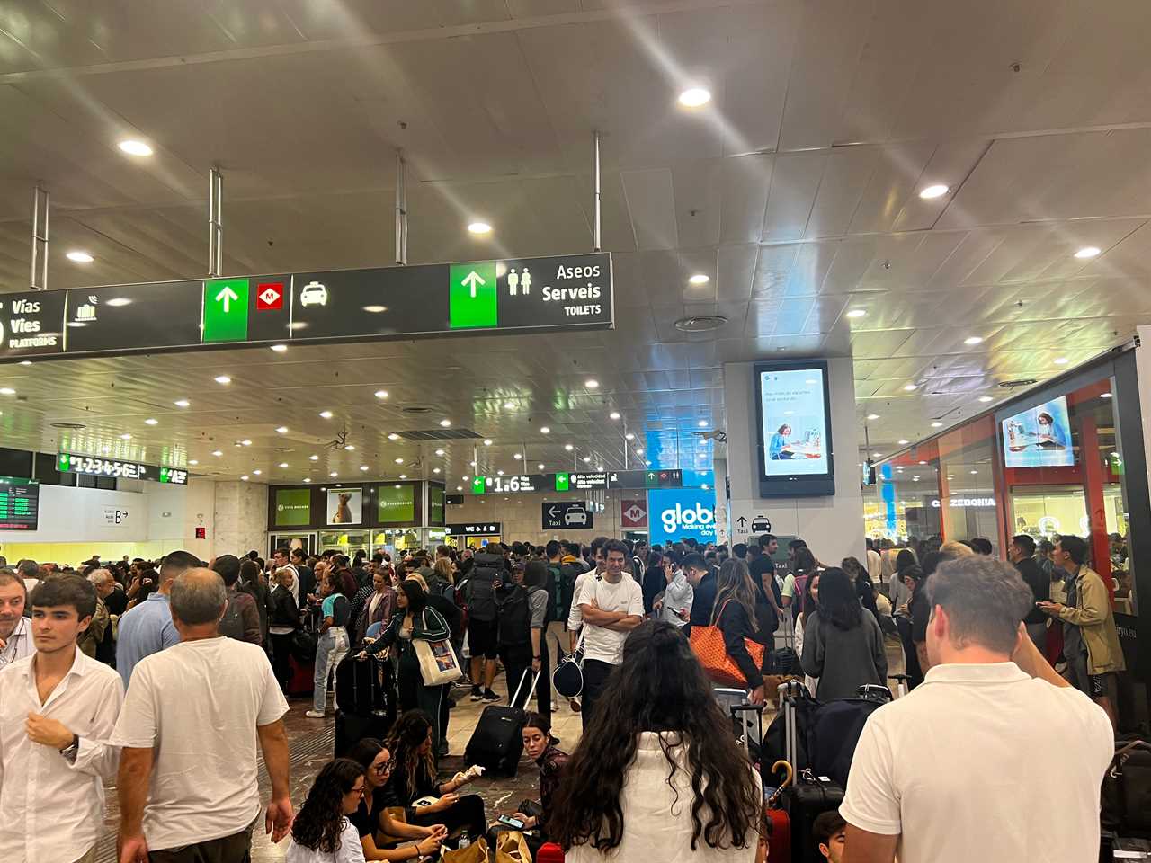 Passengers in a Barcelona train station.