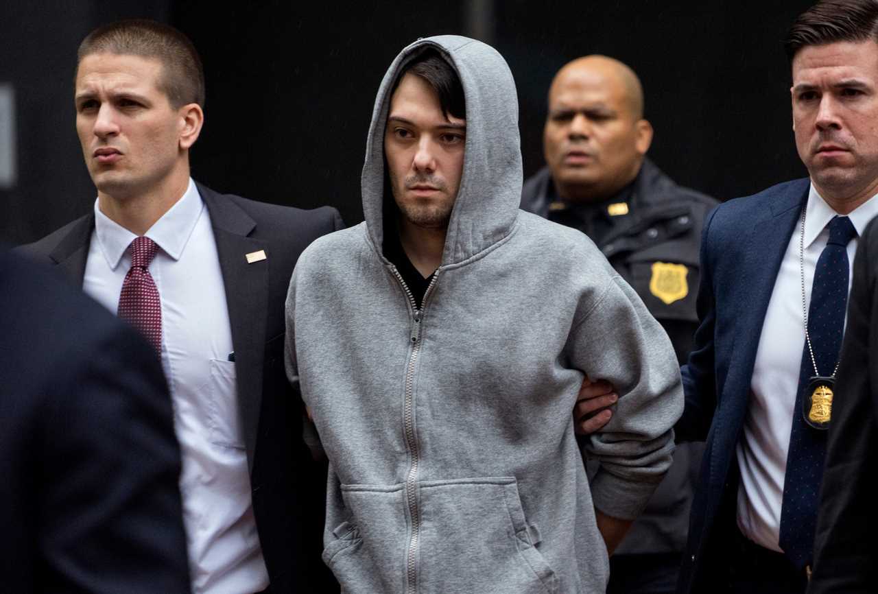 A photo of Martin Shkreli escorted by law enforcement agents in New York.