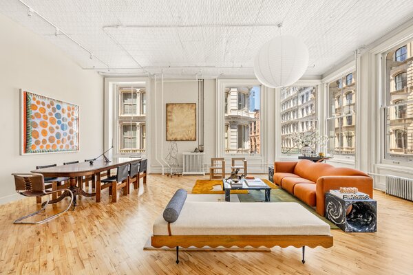 Crisp white walls and ceilings complement the refinished hardwood floors lining the home.