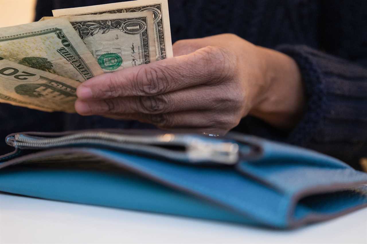 A woman counting money.