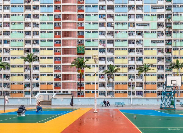 Hong Kong’s Choi Hung Estate was built between 1962 and 1964 in Wong Tai Sin District, Kowloon. The complex of 11 rainbow-colored residential blocks was one of the first waves of large public housing projects in the region.