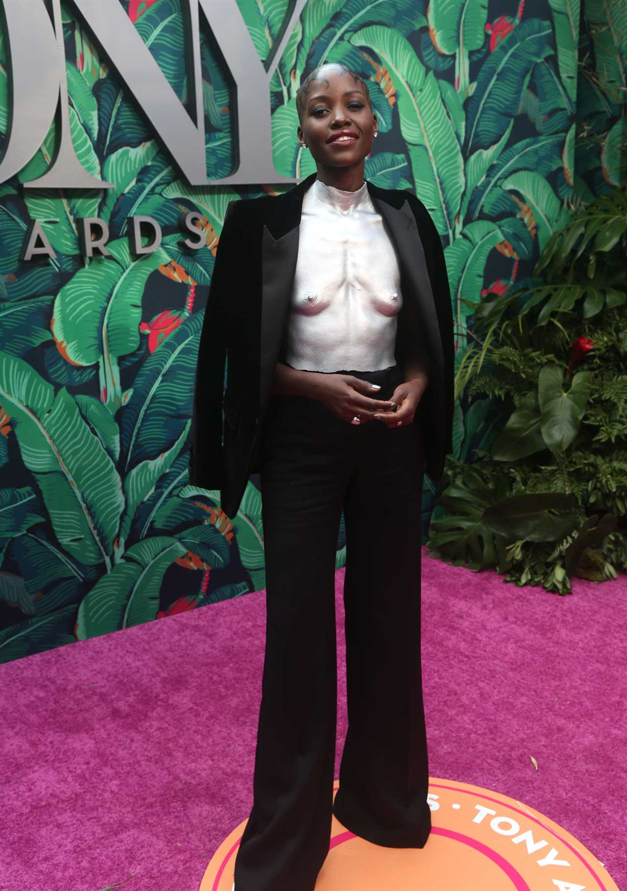 Lupita Nyong'o attends The 76th Annual Tony Awards at United Palace Theater on June 11, 2023 in New York City. She showed up in a silver breastplate that was molded after her own body.